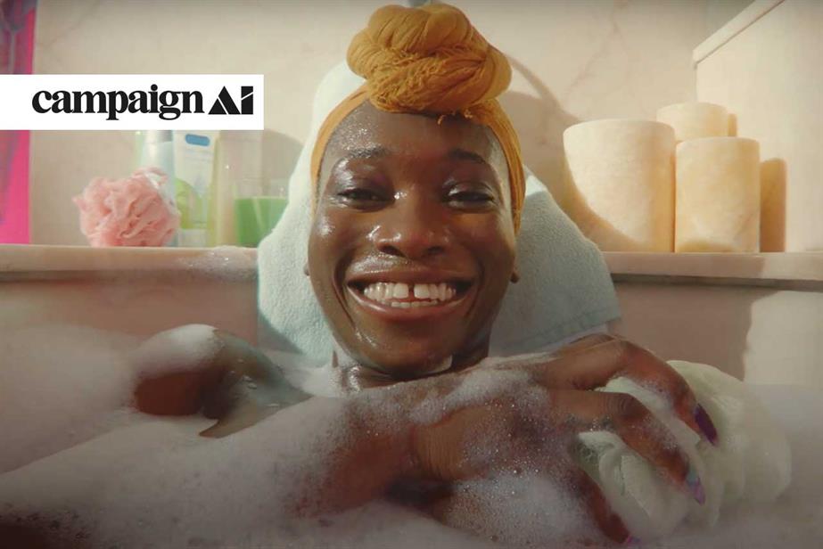 Woman with a smile soaking in bath tub holding a loofa