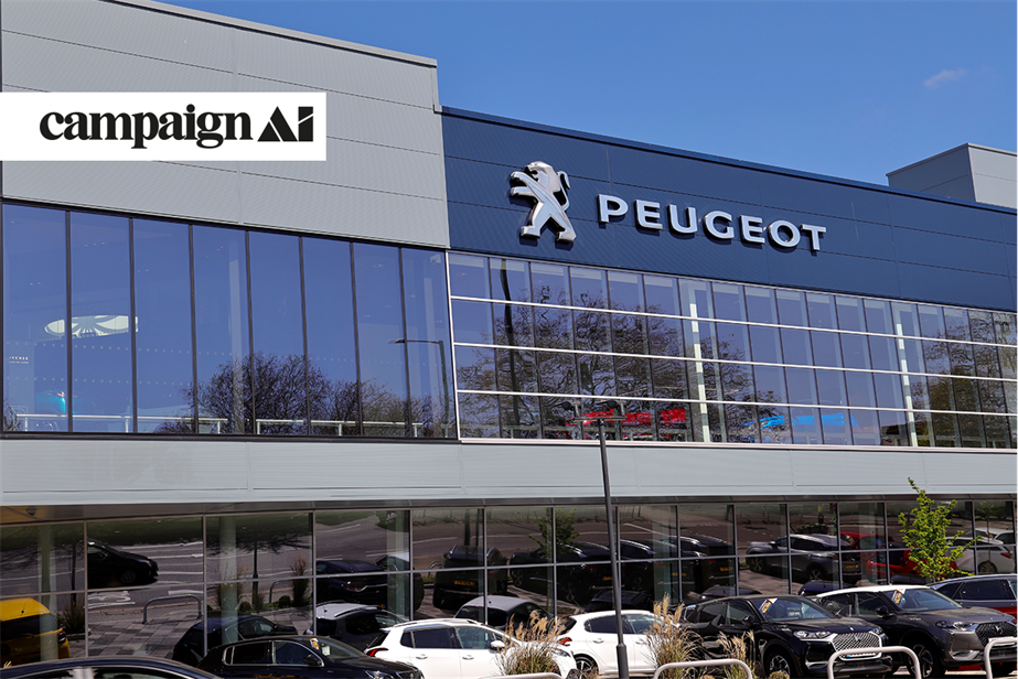 Peugeot dealership with cars in the forefront and a small tree in the right corner